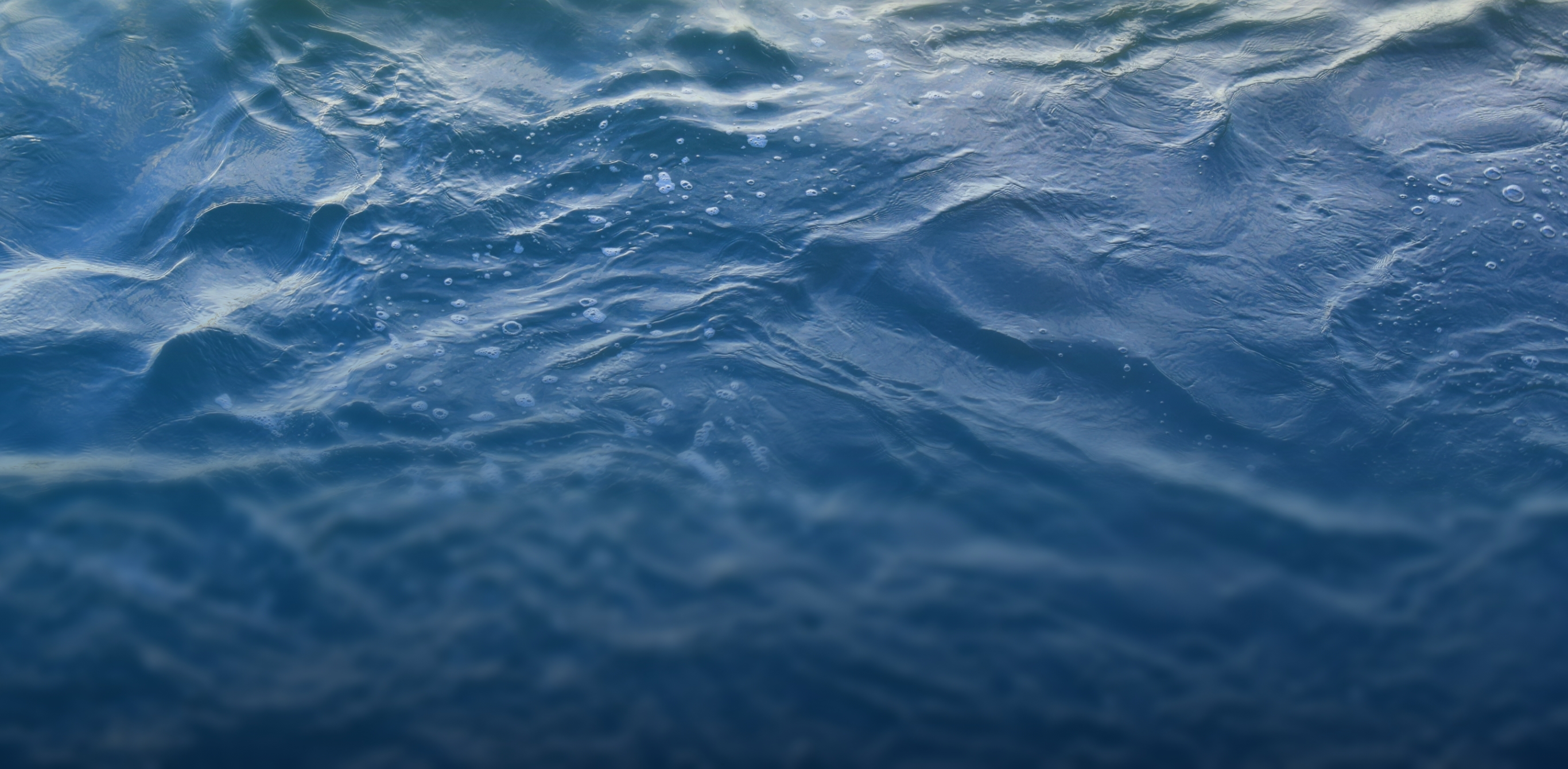 Close-up of blue water surface with ripples